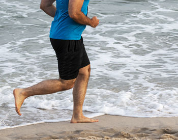 Low section of man on beach