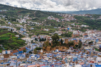 Aerial view of cityscape against sky