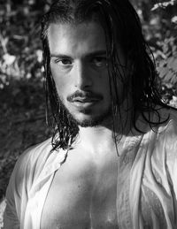 Portrait of wet man with long hair