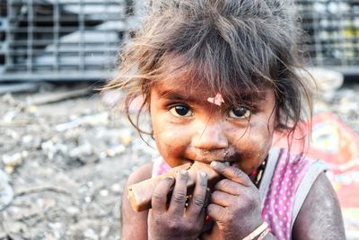 Portrait of girl eating food