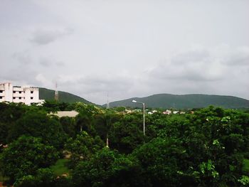 Scenic view of mountains against cloudy sky