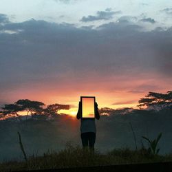 Scenic view of landscape at sunset