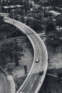 High angle view of road by trees in city