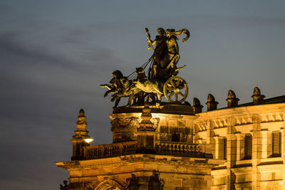 Low angle view of statue against sky in city