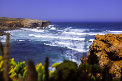 Scenic view of sea against clear sky