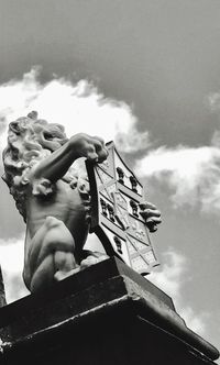 Low angle view of statue against sky