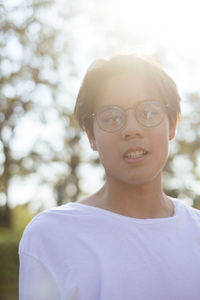 Portrait of young man wearing eyeglasses outdoors