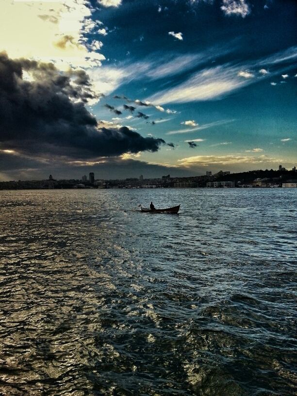 water, sea, sky, scenics, tranquil scene, tranquility, cloud - sky, beauty in nature, waterfront, rippled, nature, cloud, blue, silhouette, idyllic, transportation, nautical vessel, unrecognizable person, outdoors, horizon over water