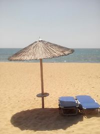 Scenic view of calm beach against sky