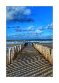 Scenic view of sea against blue sky