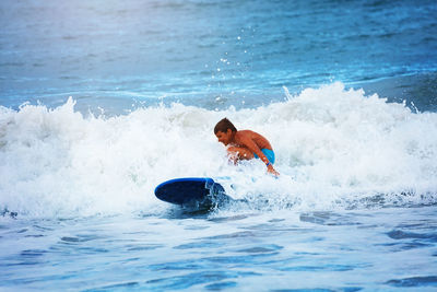 Man swimming in sea