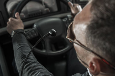 Close-up of man repairing car