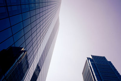 Low angle view of modern buildings against clear sky