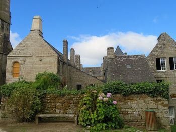 Low angle view of old medieval buildings against sky