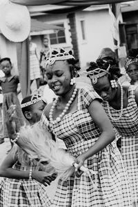 Portrait of young couple standing outdoors