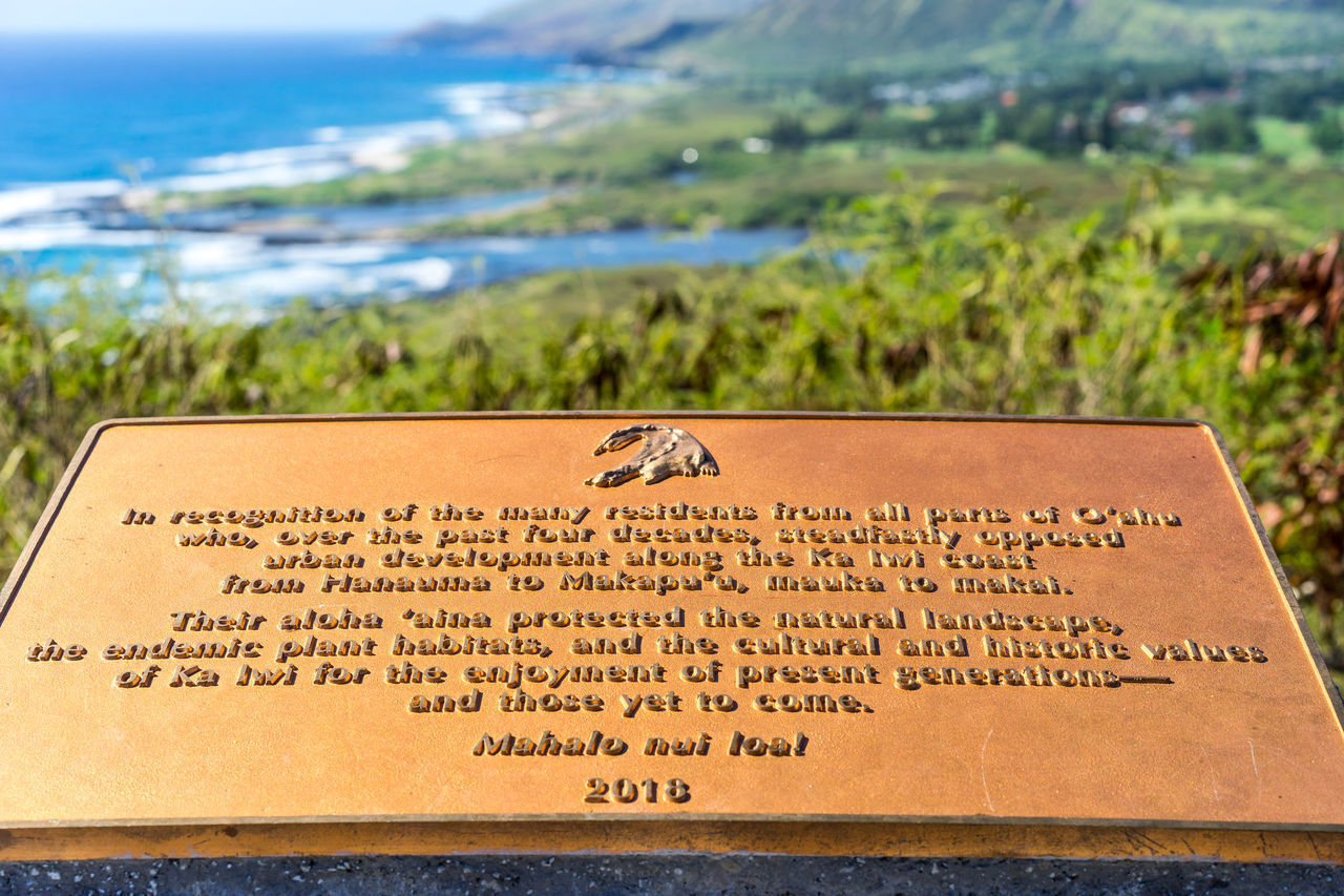 CLOSE-UP OF TEXT ON THE BEACH