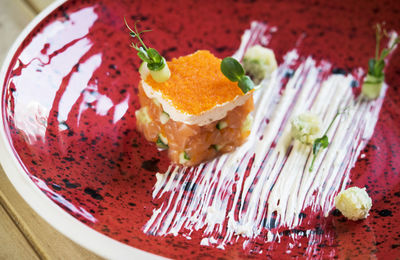 High angle view of food decorated in red plate on table