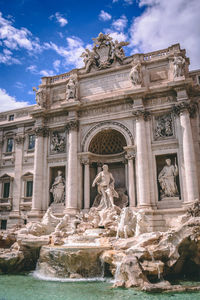 Statue in front of historical building