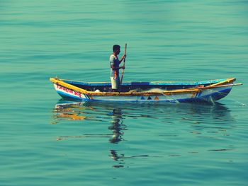 Man in boat on sea