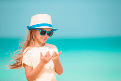 Young woman wearing sunglasses at beach