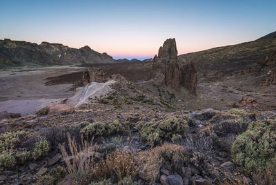 Scenic view of rocky mountains against sky during sunset