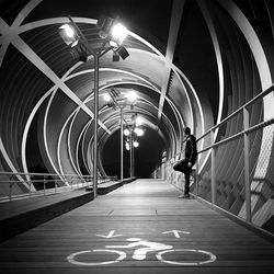 Illuminated walkway at night