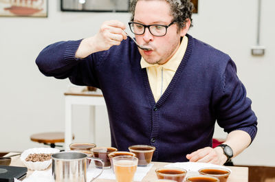 Portrait of man preparing food on table