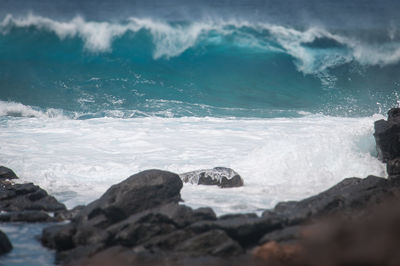 Sea waves splashing on rocks