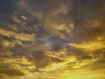 Low angle view of dramatic sky during sunset