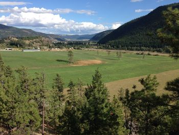 Scenic view of fields against mountain range