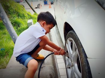 Rear view of boy in car