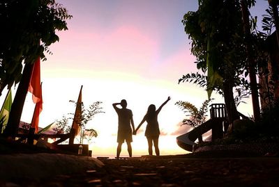 Silhouette of people at sunset