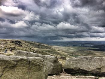 Scenic view of landscape against cloudy sky