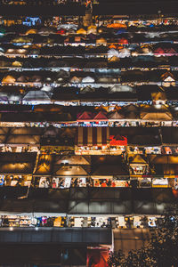 High angle view of illuminated buildings in city at night