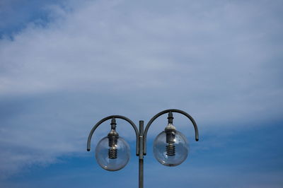 Low angle view of street light against sky