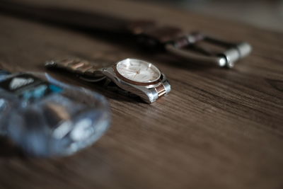 High angle view of clock on table