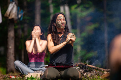 Woman sitting in a forest