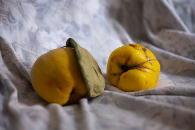 Close-up of yellow fruits on bed