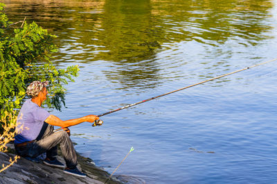 Man fishing in lake