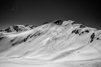 Scenic view of snowcapped mountain against sky