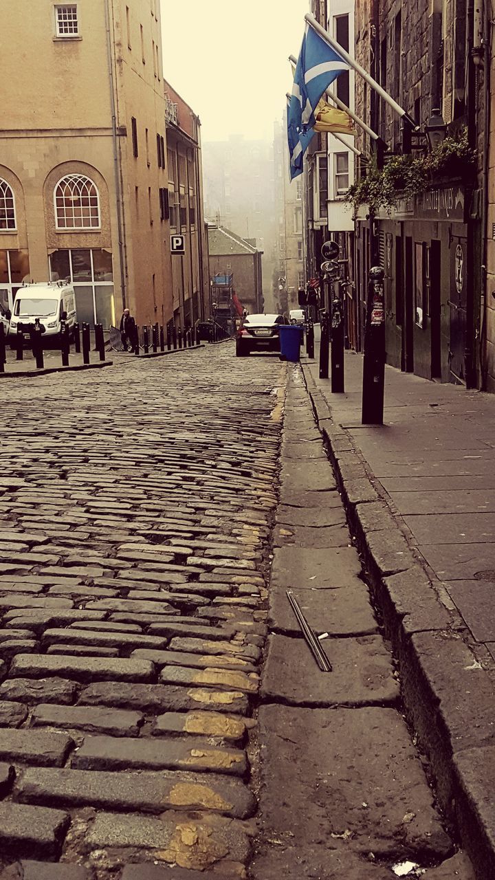 VIEW OF CITY STREET AND BUILDINGS IN BACKGROUND