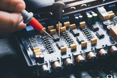 Close-up of hand holding computer keyboard