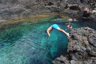 People swimming in sea