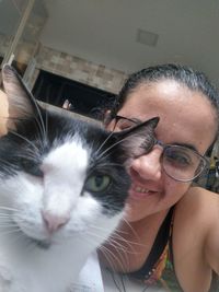 Portrait of woman with cat