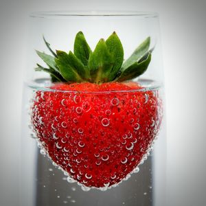 Close-up of strawberry in drinking glass