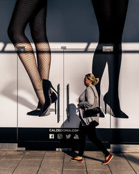 Low section of women standing on floor