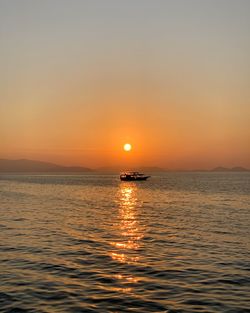 Scenic view of sea against sky during sunset in raja ampat 