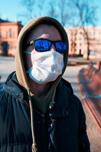 Portrait of person wearing hat standing outdoors