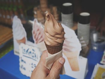 Close-up of hand holding ice cream