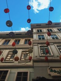 Low angle view of lantern hanging outside building